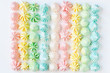  Closeup homemade Colored meringue cookies on white backround. 