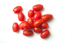Closeup Of Mini Organic Tomatoes Roma On White Background