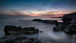 © Michalis Palis - Dramatic sunset on a Rocky coastline