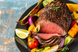 Club Beef steak with pepper sauce and Grilled vegetables on dark wooden background. Roas beef. Copy space.