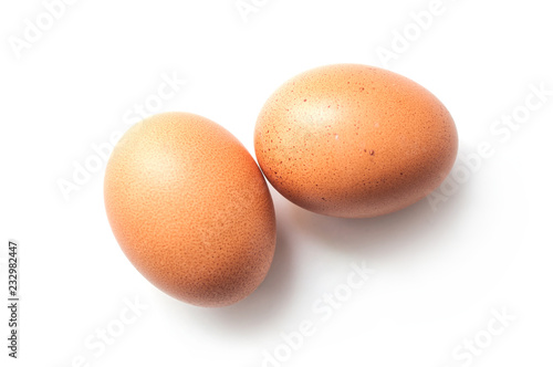 Fotomural closeup of two organic eggs on white background