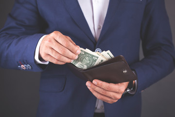 young business man hand  money with  wallet