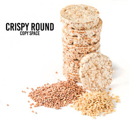 Crispy round dietary buckwheat rice fitness bread isolated on white background. Food for weight loss.