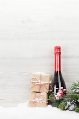 Christmas gift boxes and champagne bottle