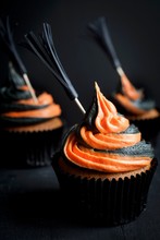 Halloween Cupcakes Decorated With Witches Broom Sticks