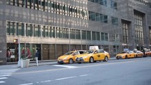 Yellow New York Taxi Cabs Stand In Line At Taxi Rank In Wall Street