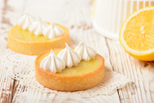 Lemon Pie On The Table With Citrus Fruits. Traditional French Sweet Pastry Tart. Delicious, Appetizing, Homemade Dessert With Lemon Curd Cream. Copy Space