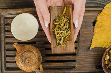 Chinese tea ceremony with Anchnag on wooden background