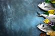 Food background with fresh raw dorado fish with ingredients for making.Top view with copy space.