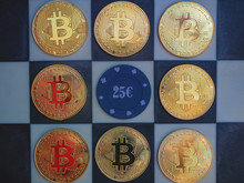 bitcoin gold coins on chess board with casino chip