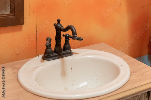 Old Sink With Vintage Faucet In A Bathroom Of Abandoned