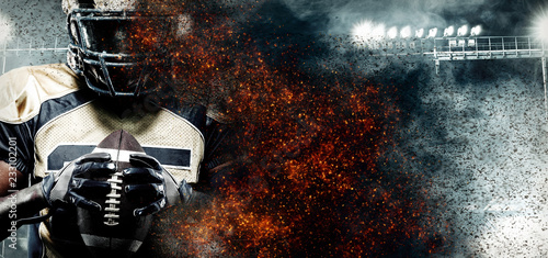 American football player, athlete in helmet on stadium in fire. Sport wallpaper with copyspace on background.