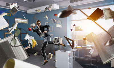 Wall Mural - Playing football in office. Mixed media