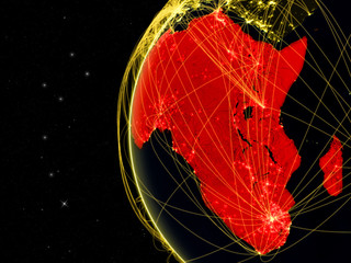 Wall Mural - Africa on dark Earth with network representing telecommunications, internet or intercontinental air traffic.