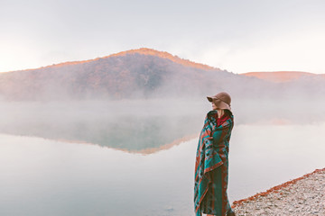 Wall Mural - Girl standing by the lake