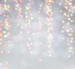 © Vjom - Grey blurred bokeh background with golden lights.