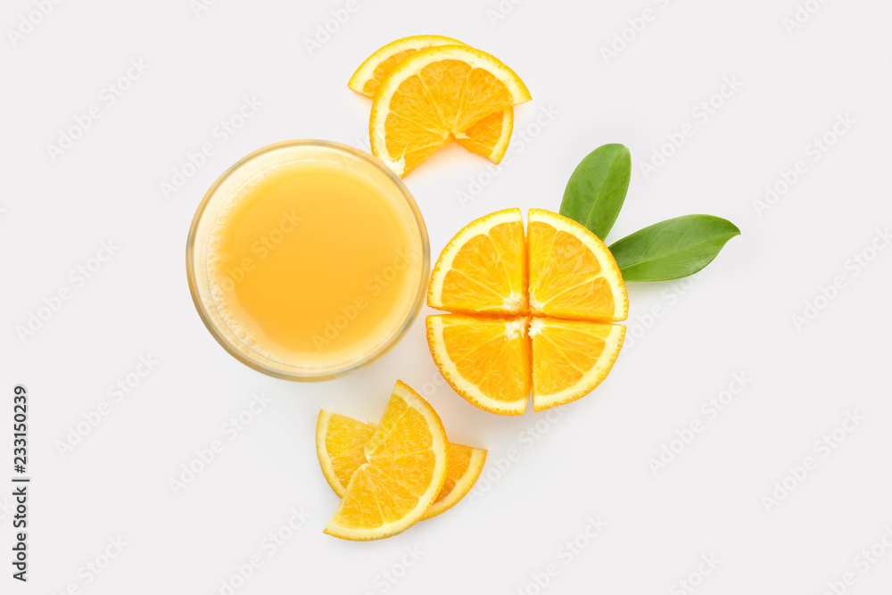 Glass of orange juice and fresh fruit on white background
