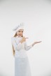 © Fotoproff - School-age girl dressed as a cook in white.