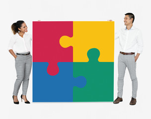 Wall Mural - Businesspeople connecting jigsaw puzzle pieces