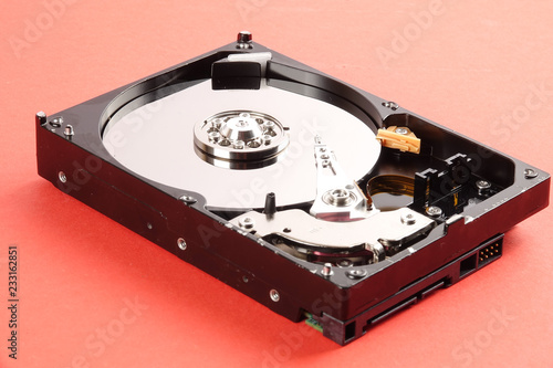 Fotografia  Hard disk drive (HDD) isolated on orange background