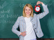 © be free - Welcome teacher school year. Looking committed teacher complement qualified workforce educators. School discipline concept. Woman teacher hold alarm clock. She cares about discipline. Time to study