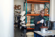 © mavoimages - Worker melting and mixing chocolate in a bowl