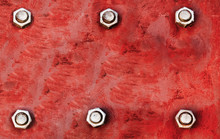 Red Metal Plate Painted With Light Red And Grey Colours And Fixed With Six Large Steel Bolt Screws In Parallel Lines As Texture Background.