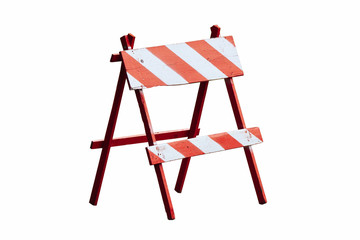 Red and white painted vintage wooden road block or barrier as wood frame barricade with four legs isolated on a seamless white background.