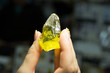 hand with a crystal of citrine