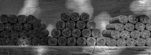 Cigars Lie Stacked On A Wooden Table In Several Blocks. View In Black And White. Concept: Cigars Or Health Or Livestyle
