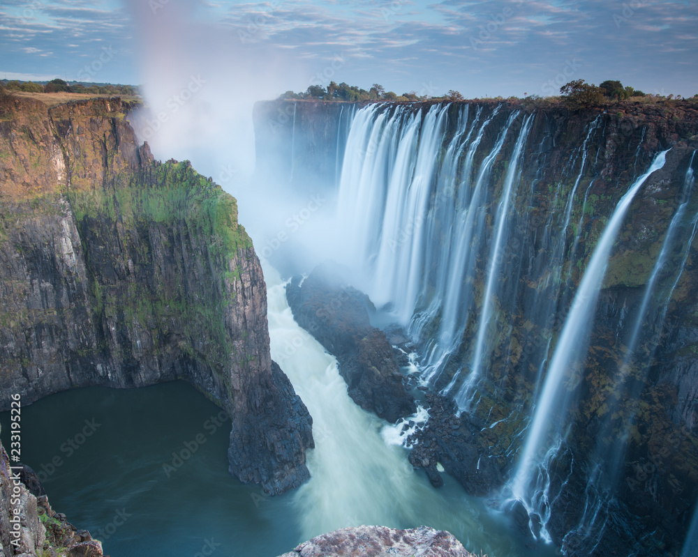 Early morning at Victoria Falls from Zambia looking into Zimbabwe - obrazy, fototapety, plakaty 