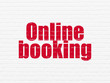 © Maksim Kabakou - Tourism concept: Painted red text Online Booking on White Brick wall background