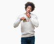 © Krakenimages.com - Afro american man holding one dollar over isolated background serious face thinking about question, very confused idea