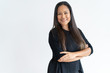 © Mangostar - Confident middle-aged lady looking at camera. Smiling woman posing with her arms crossed. Beautiful woman portrait concept. Isolated view on white background.