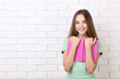 © 5second - Young girl with book on white brick wall background