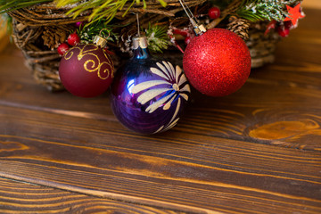 Christmas garland decoration placed on wooden planks. Copyspace for text