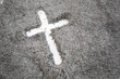 © rahwik - Christian cross or crucifix drawing in ash, dust or sand as symbol of religion, sacrifice, redemtion, Jesus Christ, ash wednesday, Ash Wednesday concept