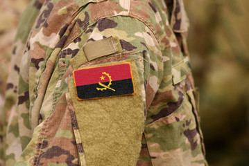 Angola flag on soldiers arm. South Republic of Angola troops (collage)