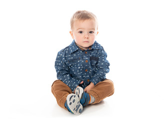 Wall Mural - A Cute Little Boy Isolated on the White Background.