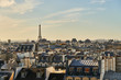 Eiffel tower and Paris roofs at sunset