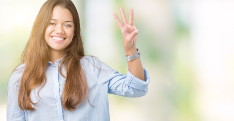 Young beautiful brunette business woman over isolated background showing and pointing up with fingers number three while smiling confident and happy.