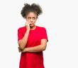 © Krakenimages.com - Young afro american woman over isolated background looking stressed and nervous with hands on mouth biting nails. Anxiety problem.