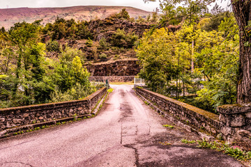 Old bridge over the river Ax-les-thermes. Ariege France