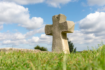 Orthodox cross close up on the tower of the middle church in the background of blue sky and clouds. The concept of Christianity, the symbol of the Orthodox faith in God