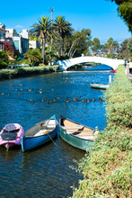 Canoes In A Canal And A Bridge Over One Of The Canals In Venice, California