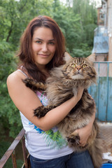 Wall Mural - girl with a Maine Coon cat