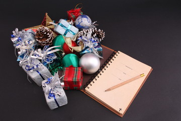 Decorations for Christmas and the Bible with black backdrop.