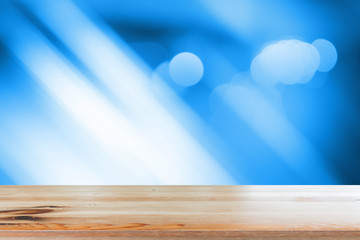 Canvas Print - wooden desk with blue gradient tone abstract background bokeh circles for christmas background