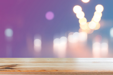 Canvas Print - wooden desk with blurred light bokeh abstract background