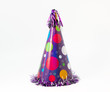 Birthday carton party cone hat with balloons isolated on white background.